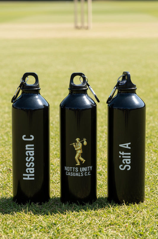 Three black water bottles with names and branding on a grassy field