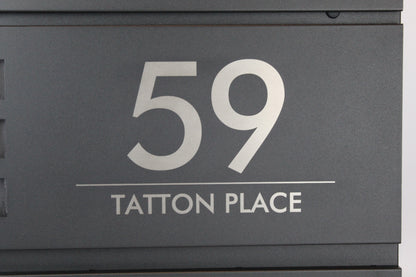 Personalised black mailbox with house number and address engraved
