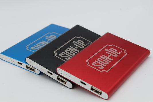 Three power banks in blue, black, and red with company branding on a white background