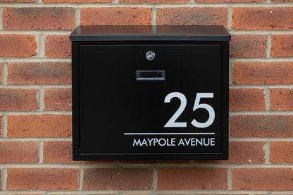 black mailbox with house number and street name